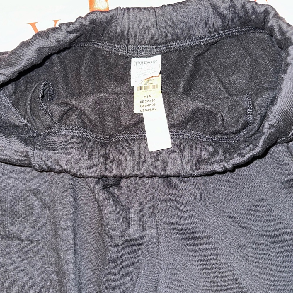 Pink logo dad shorts black and tan are new with tags. Gray is used. - Picture 3 of 10